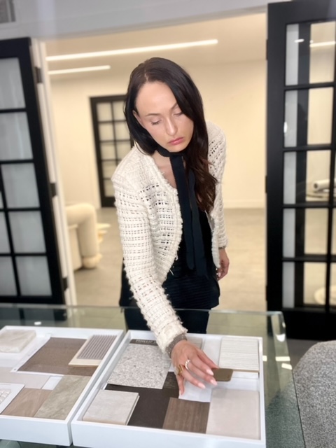 Liz Robertson reviews swatches and textures for a current project.